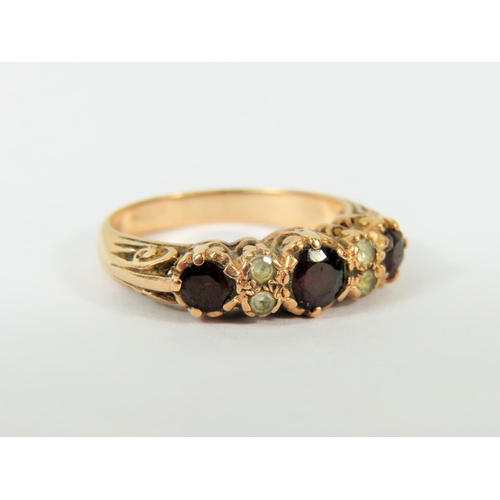 121 - Gypsy style 9ct Yellow Gold Ring set with Garnets and Clear Gemstones.   Finger size 'Q'   4.0g