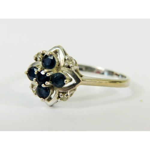 126 - 9ct White Gold Sapphire and Diamond set Flower pattern Ring.   Finger size  U-5     3.0g