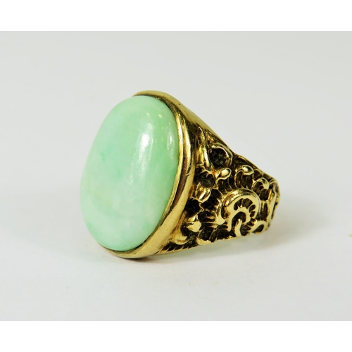 127 - Large Oval Jade ring set in a heavy 9ct Mount with scrolled shoulders.   Finger size 'Q'   Total wei... 