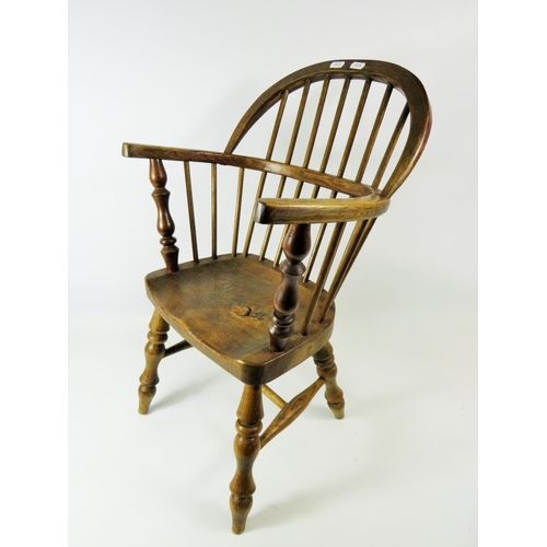 90 - Well made Oak Childs size Windsor stick chair with turned legs.  Seat height 11 inches,  Height to b... 