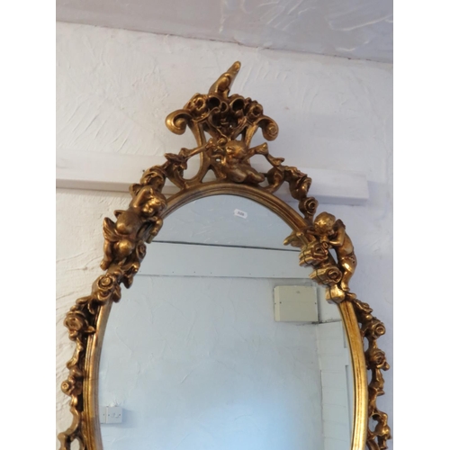 91 - Attractive composite framed mirror which measures approx 39 x 23 inches. See photos.