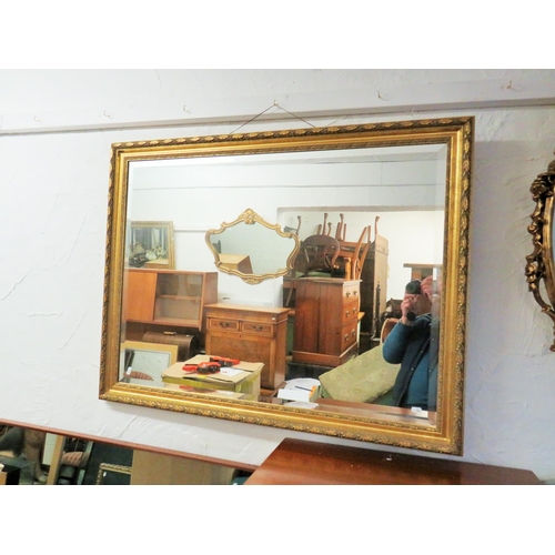 92 - Large Composite framed gilt mirror with bevelled glass. Approx 44 x 34 inches. See photos.