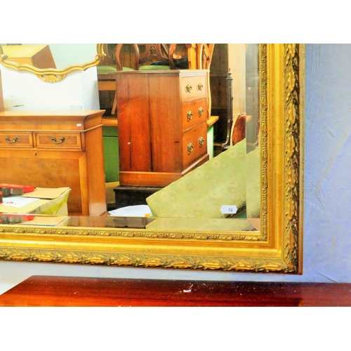 92 - Large Composite framed gilt mirror with bevelled glass. Approx 44 x 34 inches. See photos.