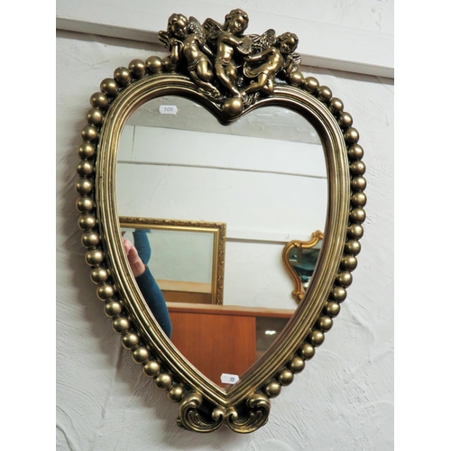 95 - Heart shaped mirror with baubles and cherub decorations. Measures approx 24 x 17 inches. See photos.