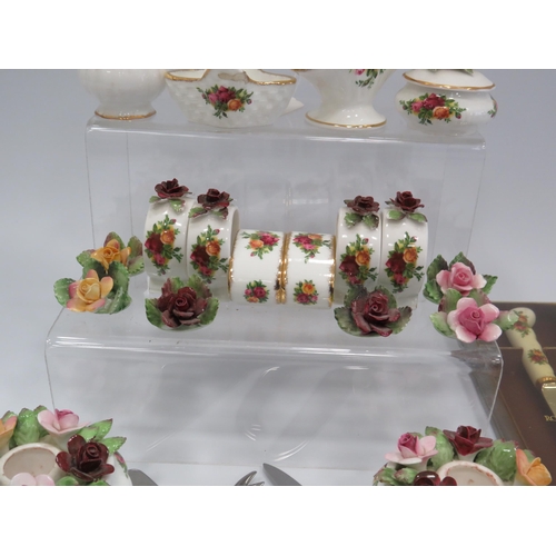 219 - Selection of Royal Albert Old Country roses including place settings, napkin rings, cutlery etc.