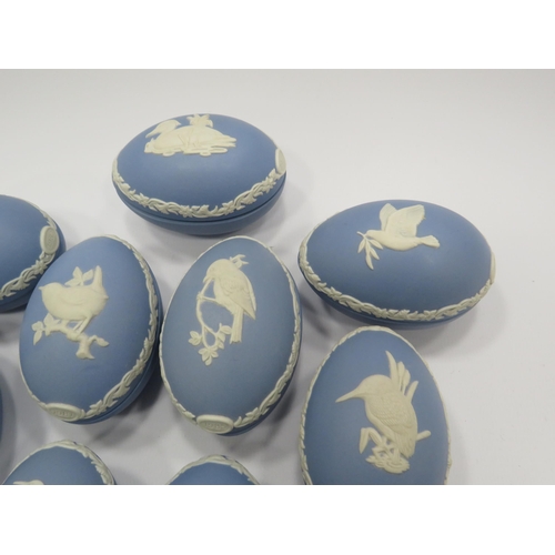 226 - 9 Wedgwood Jasperware light blue christmas eggs decorated with various birds.