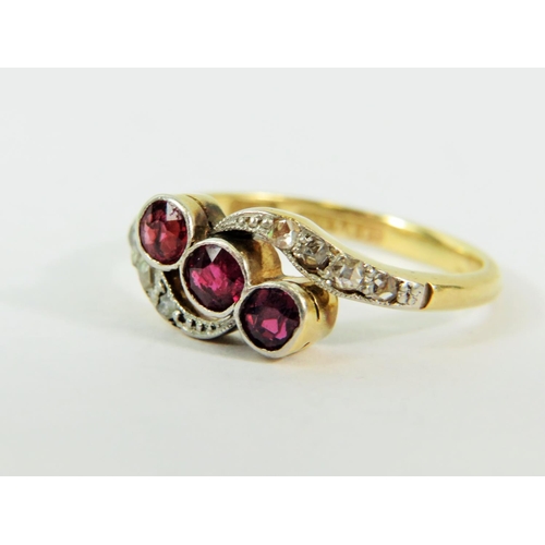 133 - 18ct Yellow Gold Ring set with Three Rubies with Diamond set waves to top and bottom.   Finger size ... 