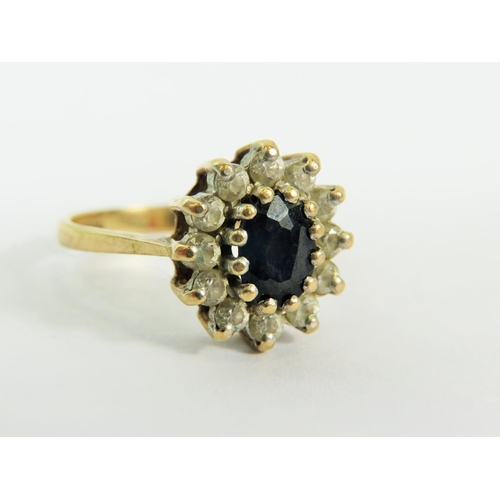 136 - 9ct Yellow Gold ring set in a Flower pattern.   Finger size 'N-5'  2.8g