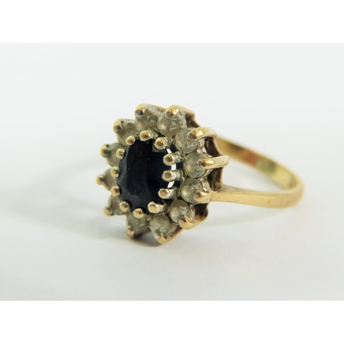 136 - 9ct Yellow Gold ring set in a Flower pattern.   Finger size 'N-5'  2.8g