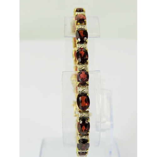 142 - 14ct Yellow Gold Garnet and Diamond set bracelet. 7 inches long.   13g