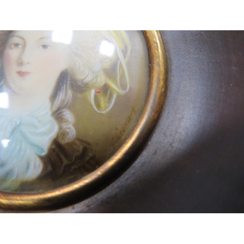 243 - Small framed miniature portrait, frame measures 9.5cm diameter.