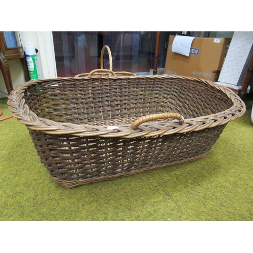 254 - Large vintage wicker moses basket plus a small wicker carry basket.