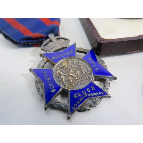 266 - 7 Rifle club tokens/ medals , one is sterling silver.