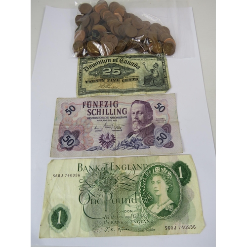 282 - English pound note, 2 foreign banknotes and 300 grams of 1/2 pennies.