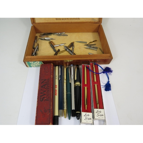 283 - Wooden cigar box containing various pens and nibs.