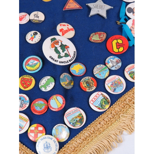 296 - Large selection of various badges including a 1964 Butlins badge.