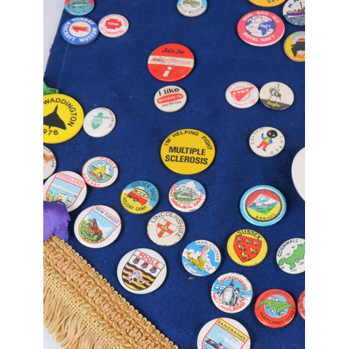 296 - Large selection of various badges including a 1964 Butlins badge.