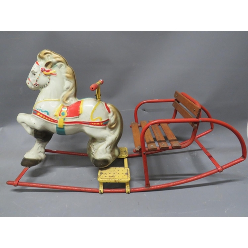 506 - Vintage Childs Rocking horse chair made from pressed metal and tubular steel. Approx 24 x 38 inches.... 