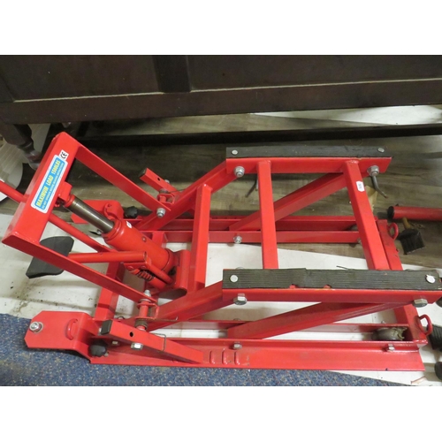 509 - Hydraulic action Motorcycle lift plus bottle jack and paddock stand.  See photos.   S2