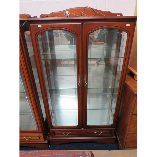 524 - Matched pair of mirror backed glass display cabinets with glass doors. Both illuminated with 240v lI... 