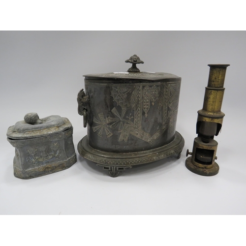 312 - Antique pewter tea chest, lead tobacco jar and a vintage brass microscope.