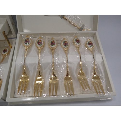 402 - Royal Albert Old Country roses gold plated cake fork set and teaspoon set unused in boxes.