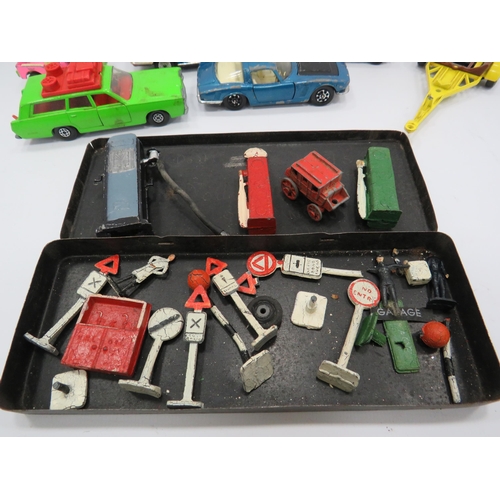 427 - Selection of vintage Dinky road signs, petrol pumps etc and a some playworn diecast vehicles.