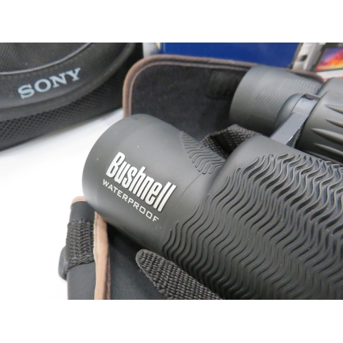 462 - Sony handycam, olympus camera and Bushnell binoculars.