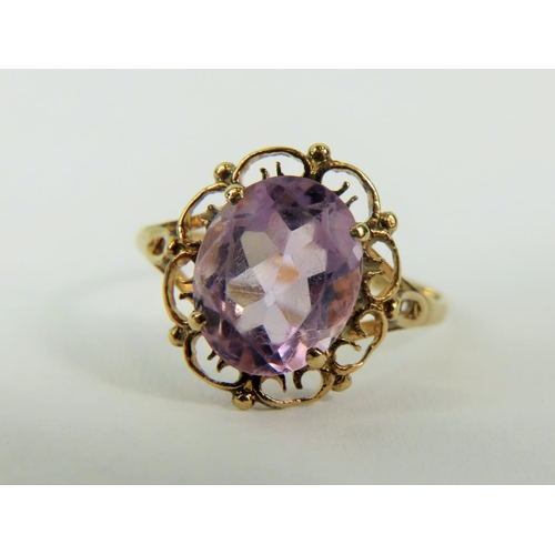 156 - 9ct Yellow Gold ring set with an pale Amethyst oval.   Finger size 'K'   1.7g total.   See photo.