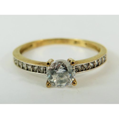 167 - 9ct Yellow gold CZ set ring.