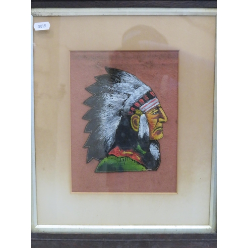 569 - Framed handpainted piece of leather of a Native American Indian, the frame measures 19