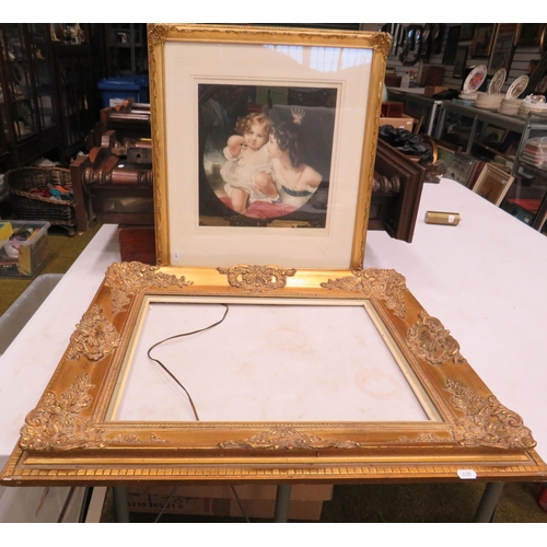 570 - Large gilt rococo style frame 63cm by 72cm plus a signed framed print in a gilt frame.