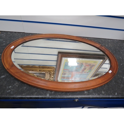 590 - Wooden framed oval bevel edge mirror, 30.5