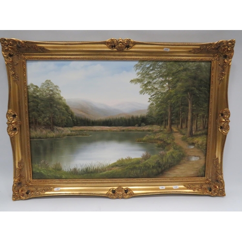 606 - Oil on Canvas of a Lakeside Woodland walk by T Falmer?  Nicely mounted in a gilt frame which measure... 