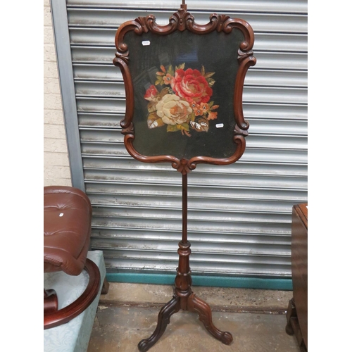 632 - Victorian era firescreen in mahogany. Adjustable height screen has needlepoint Rose decoration behin... 