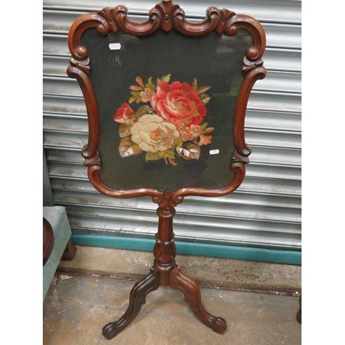 632 - Victorian era firescreen in mahogany. Adjustable height screen has needlepoint Rose decoration behin... 