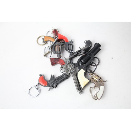 363 - Collection of Gun Key rings     484810