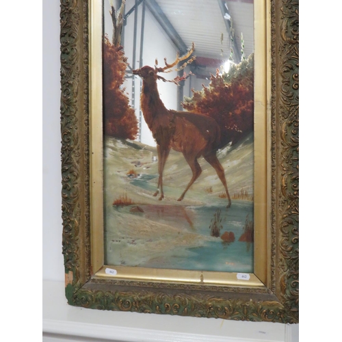 643 - Victorian era painted glass mirror in ornate gilt frame which features a woodland stag.  43 x 20 Inc... 