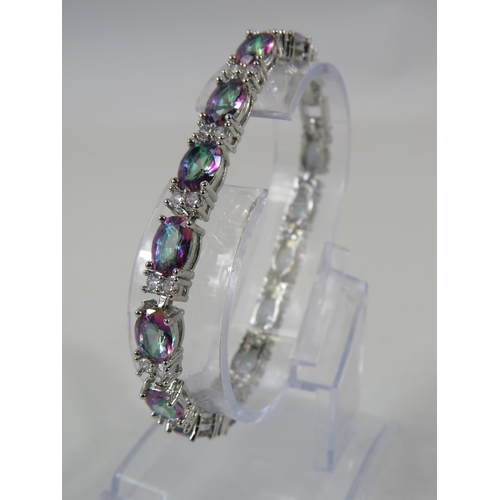 164 - 925 silver Mystic topaz and clear gemstone tennis bracelet with extension link.