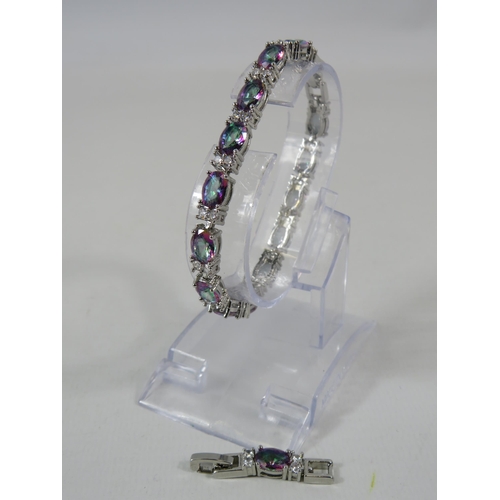 164 - 925 silver Mystic topaz and clear gemstone tennis bracelet with extension link.