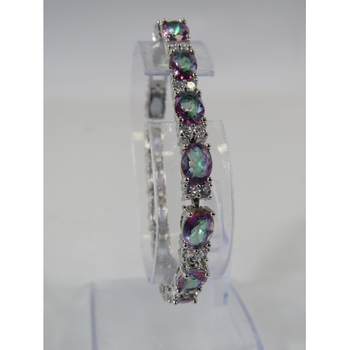 164 - 925 silver Mystic topaz and clear gemstone tennis bracelet with extension link.