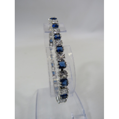 165 - 925 silver blue and clear gemstone tennis bracelet with extension link.