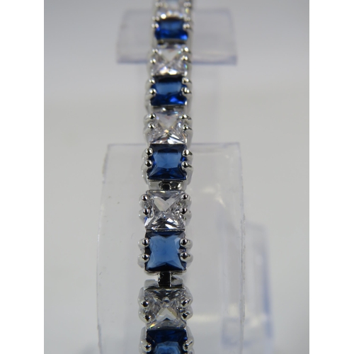 165 - 925 silver blue and clear gemstone tennis bracelet with extension link.