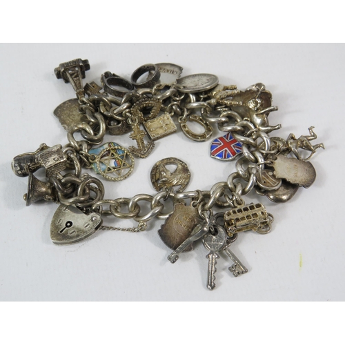 166 - Sterling silver Charm bracelet with padlock and 21 charms total weight 71g