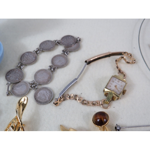 169 - Selection of various vintage costume jewellery including a sterling silver coin bracelet and a rolle... 