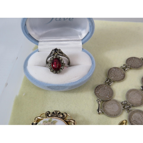 169 - Selection of various vintage costume jewellery including a sterling silver coin bracelet and a rolle... 