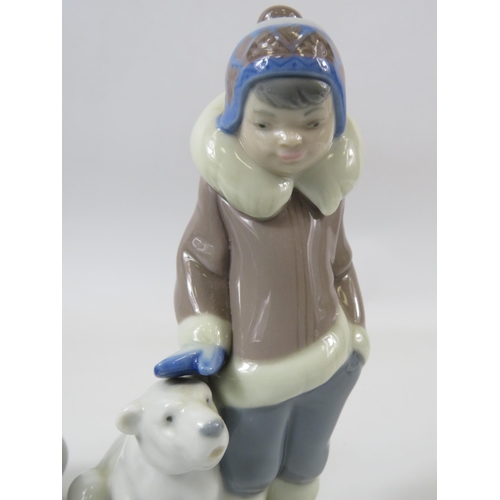 23 - 2 Lladro figurines of Eskimo boys with Polar bears. The tallest measures 15cm.