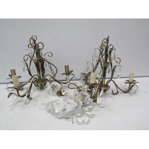 835 - Two modern 3 arm bronze effect chandeliers.