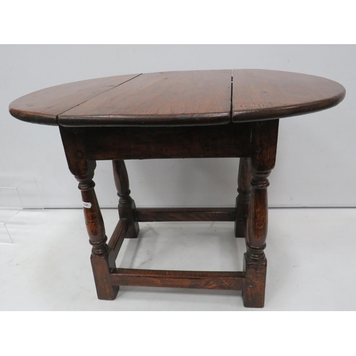 839 - Small antique Oak drop leaf table with swivel top, 47cm high, the top measures 63cm by 47cm when ope... 