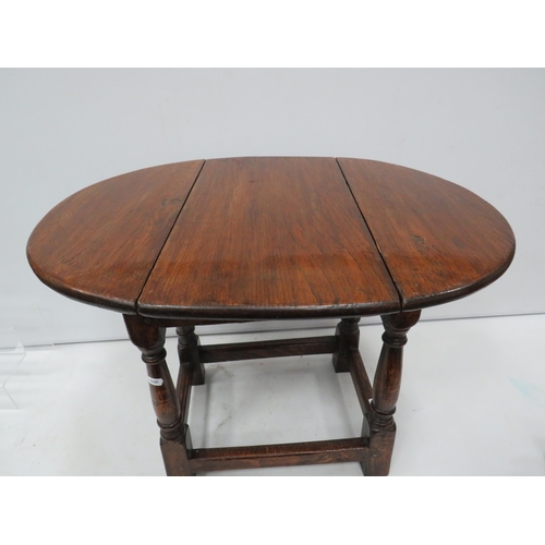 839 - Small antique Oak drop leaf table with swivel top, 47cm high, the top measures 63cm by 47cm when ope... 